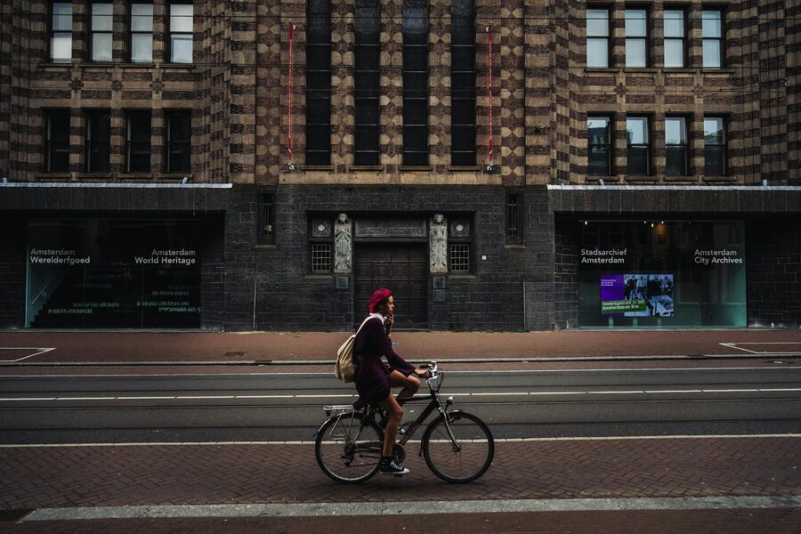 Woman cyclist on European city street