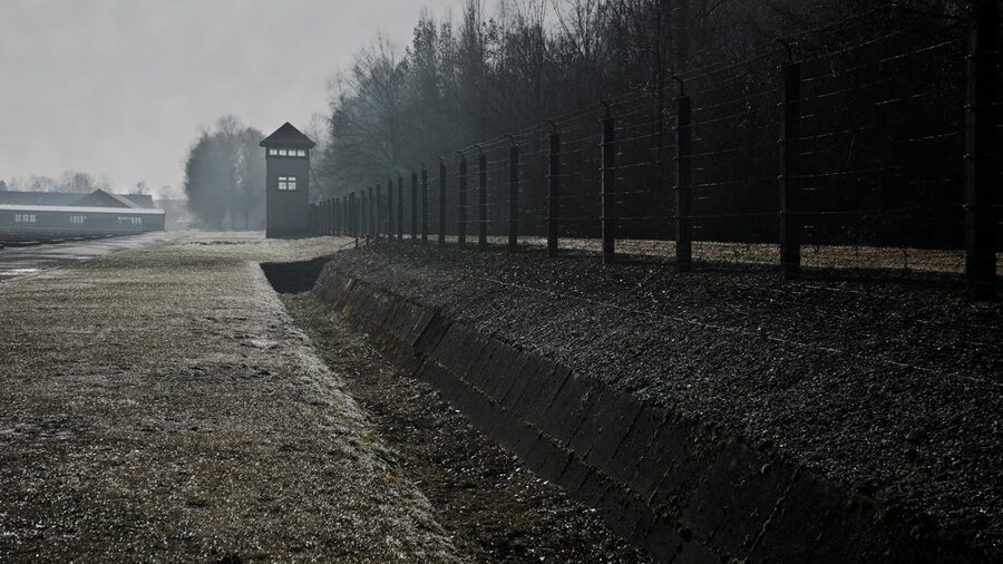 Guard tower and perimeter fence at Dachau memorial