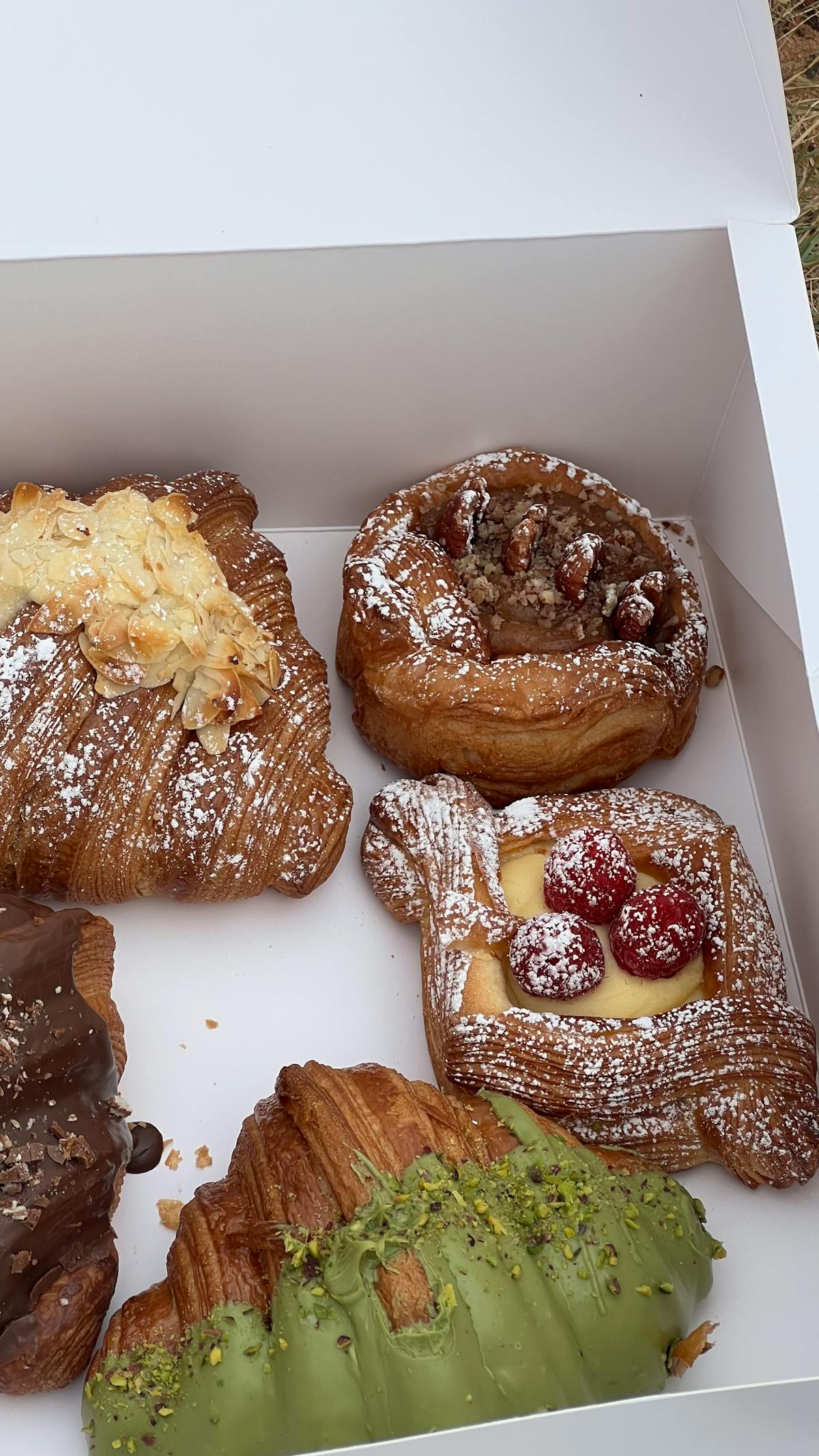 Assorted gourmet pastries including croissants and Danish pastries