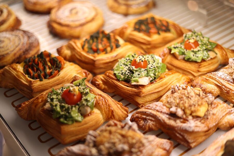 Vibrant array of gourmet Danish pastries showcasing various toppings in a Copenhagen bakery