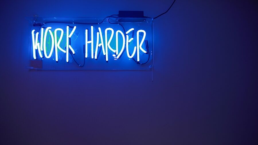 Blue work harder neon sign