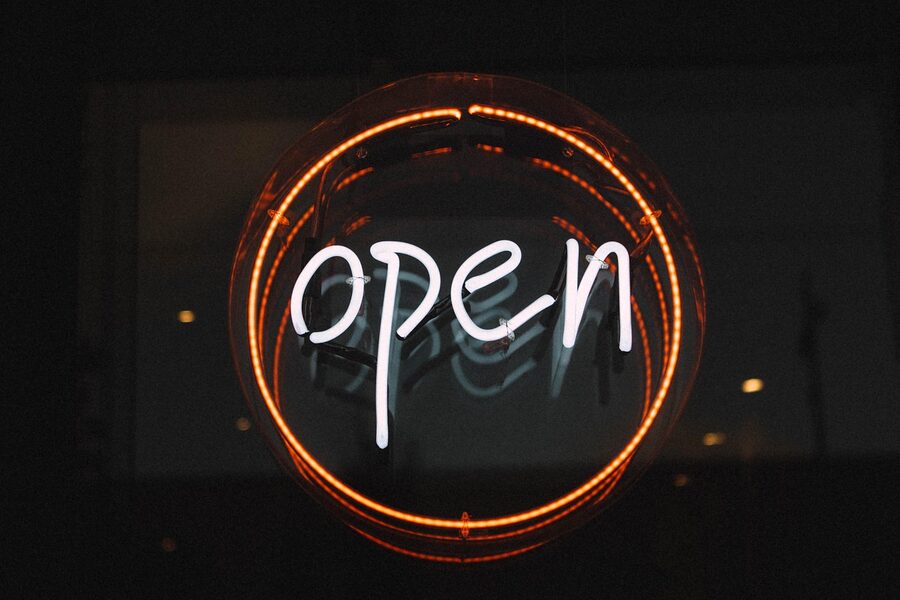 Open illuminated neon entry sign