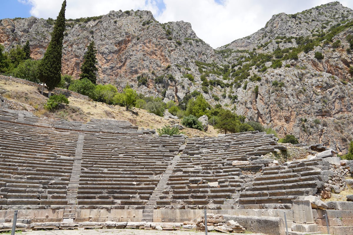 Greek theater ruins at Delphi in mountainous landscape