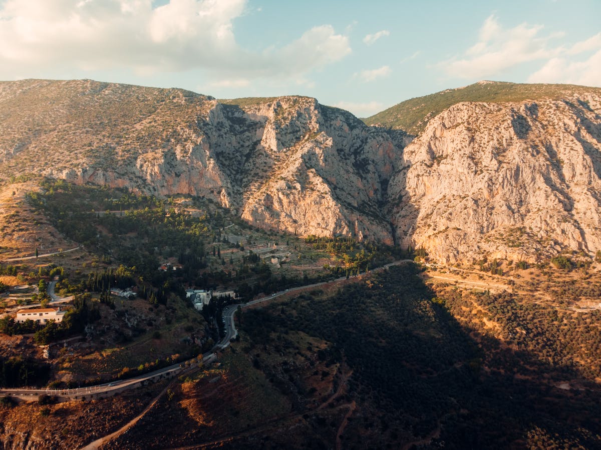 Aerial shot of Delphi's rugged mountains at sunset