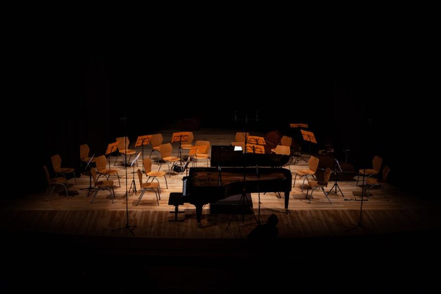 Dimly lit concert hall with grand piano