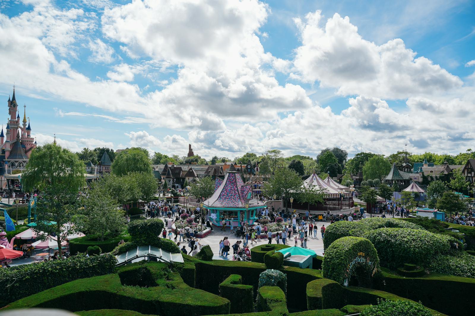 Disneyland Paris Main Street with guests enjoying the atmosphere near the castle