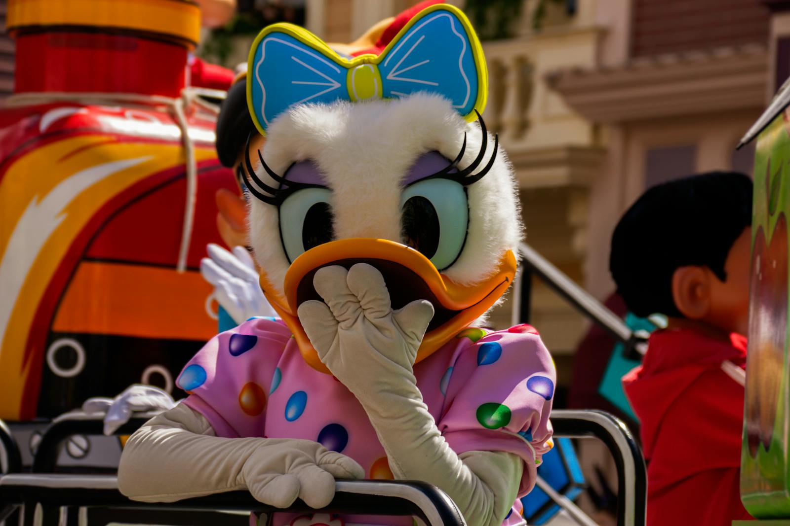 Disney character parade in Chessy at Disneyland Paris featuring themed costumes