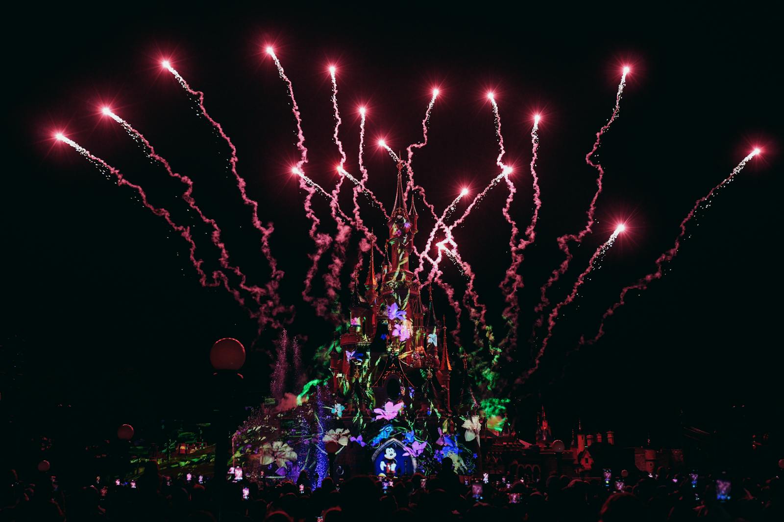 Fireworks lighting up the night sky over Disneyland Paris castle