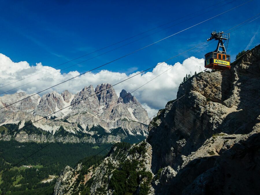 Cable car crossing high above Dolomite peaks