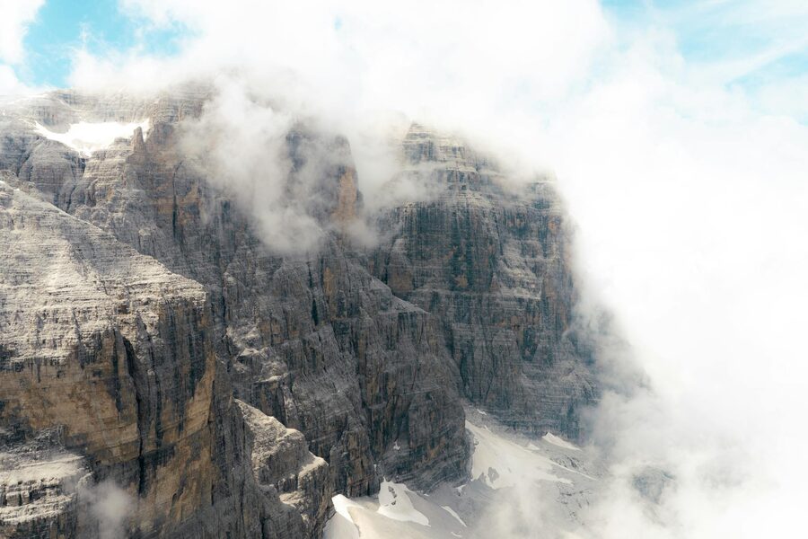 Misty Dolomites with clouds and rugged cliffs