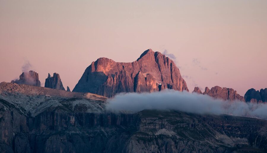 Dolomites at sunset with soft clouds