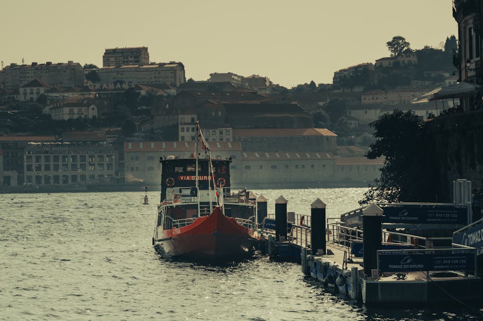 Boats on the Douro River with Porto in the background