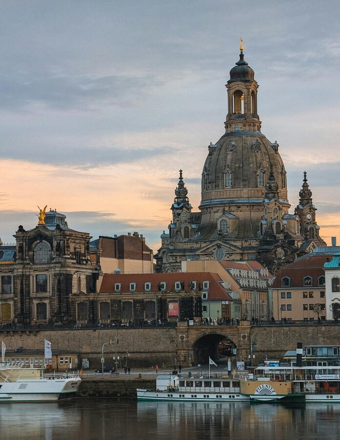 Dresden Frauenkirche dome at sunset by the river