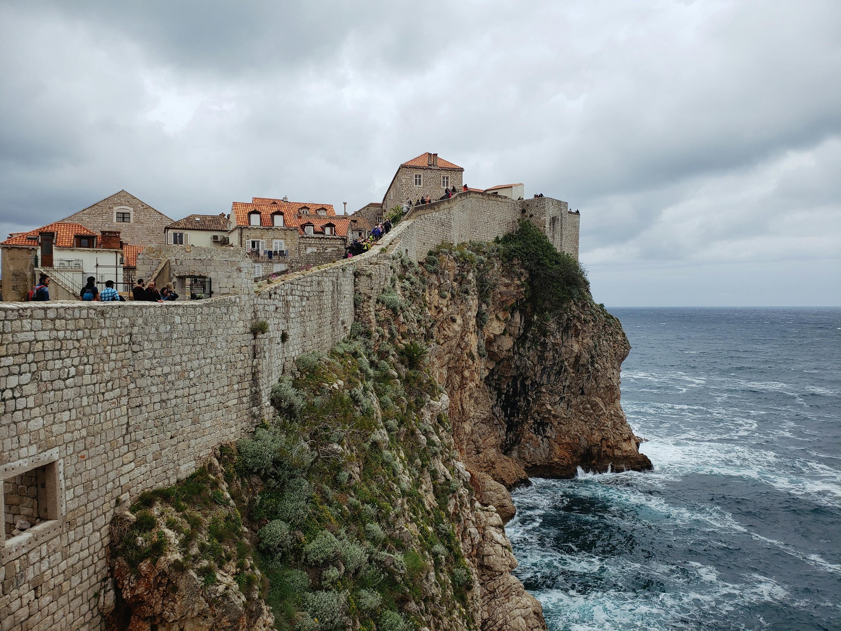 Breathtaking view of Dubrovnik's historic city walls perched above the Adriatic Sea