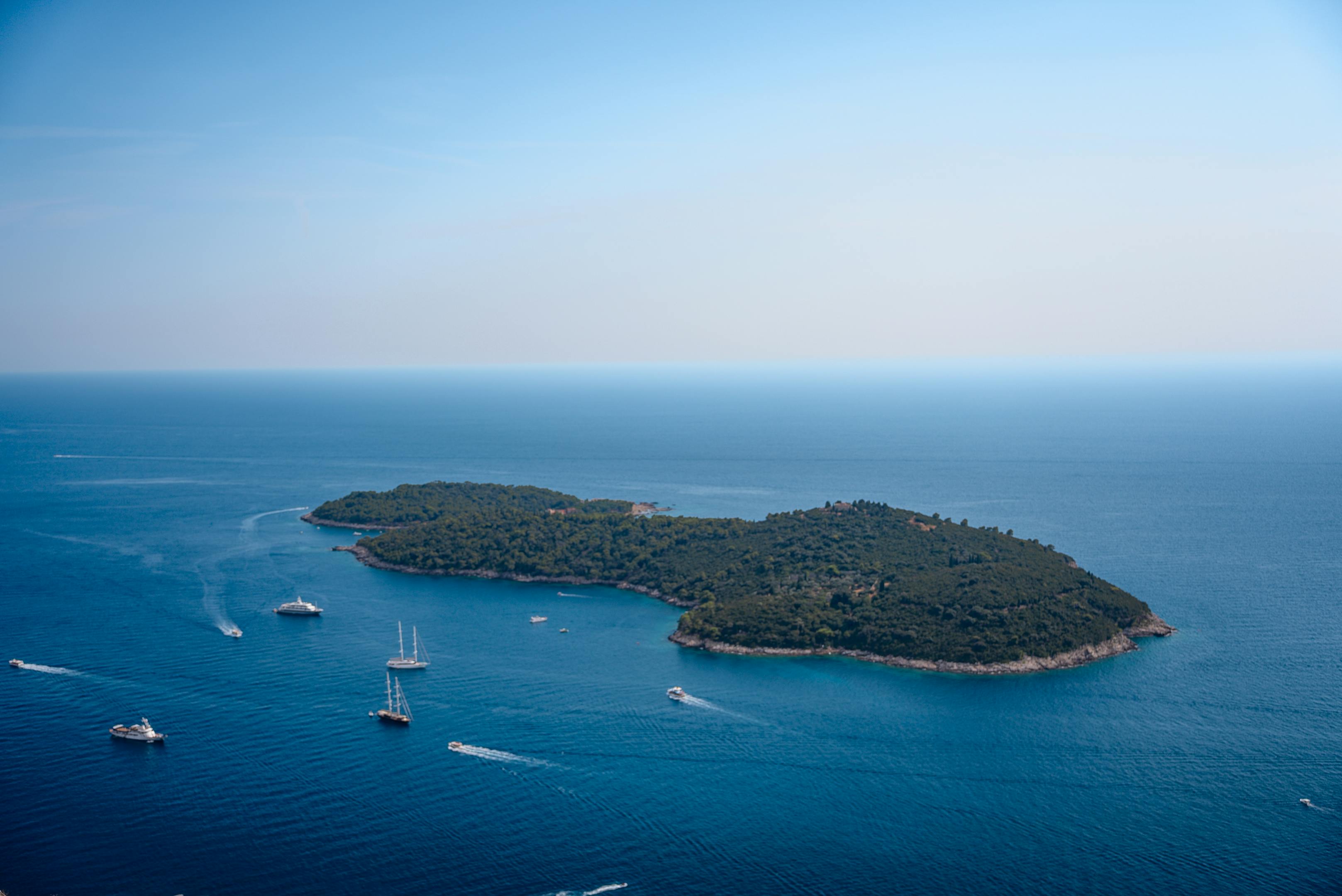 Aerial view of an island with boats in the Adriatic Sea near Dubrovnik, Croatia