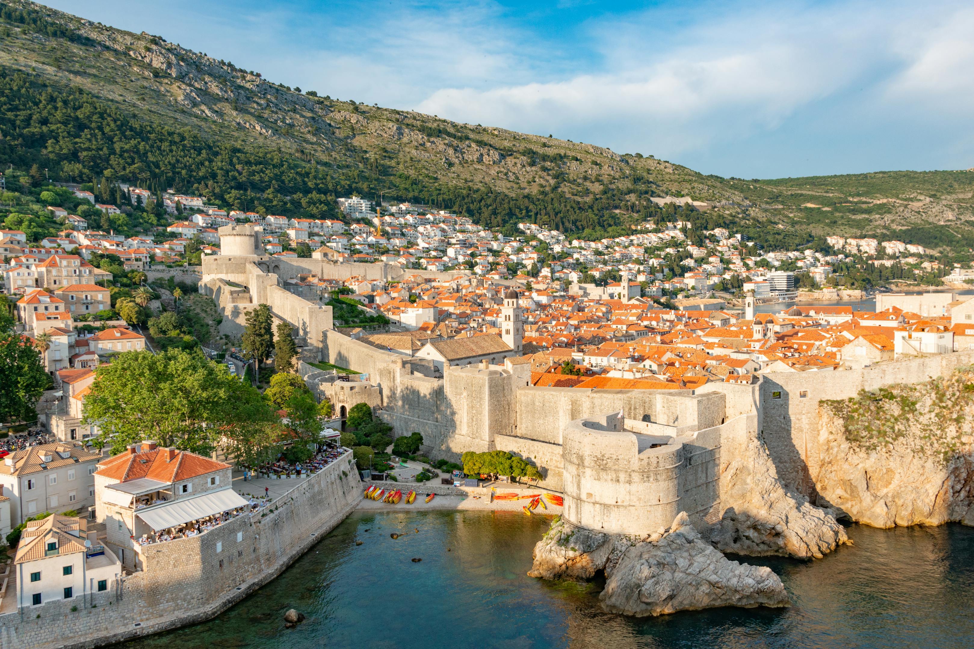 Aerial view of Dubrovnik's ancient city walls curving along the Adriatic coastline