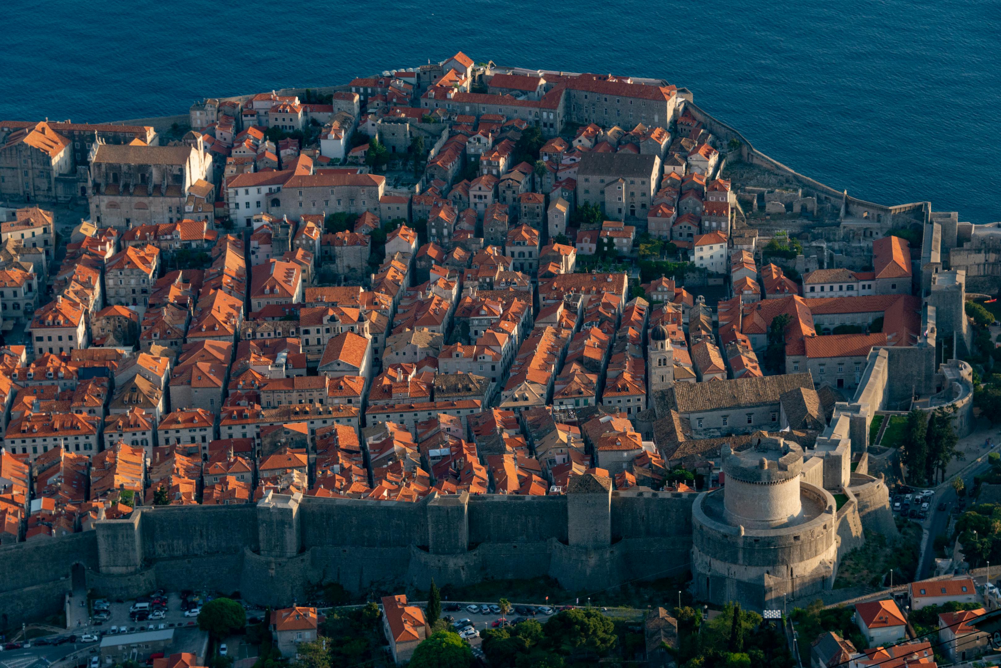 Aerial view of Dubrovnik's Old Town showing ancient city walls and red-tiled roofs