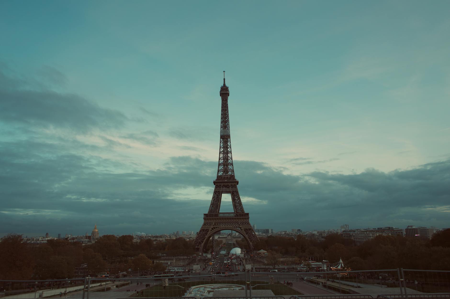 Eiffel Tower at twilight with deep blue sky above the city of Paris