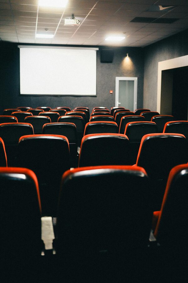 Empty theater with red-trimmed seats for film screenings