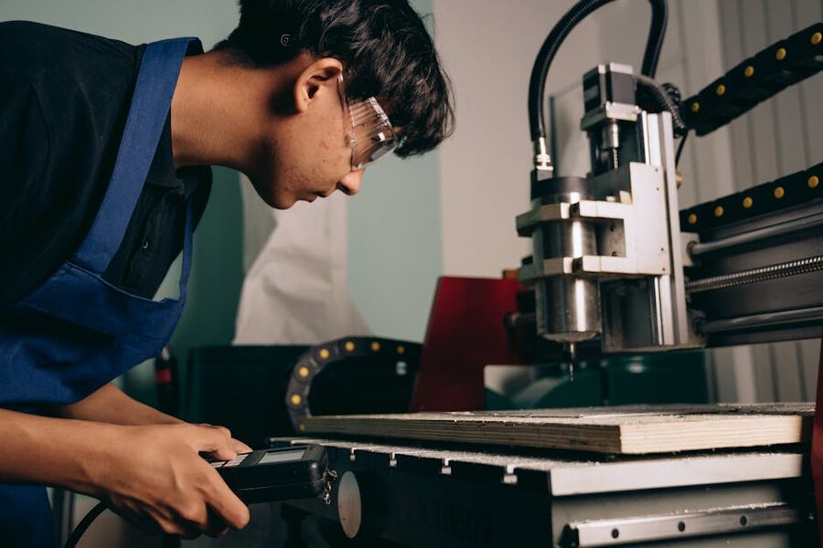 Young person operating precision machine