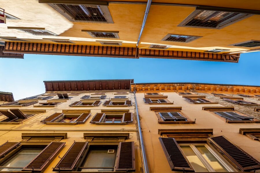 Upward view of narrow Florence alley with classic Italian architecture
