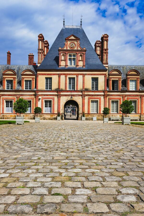Cobblestone courtyard of Chateau de Fontainebleau