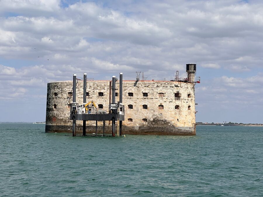 Fort Boyard fortress in the Atlantic Ocean under a cloudy sky