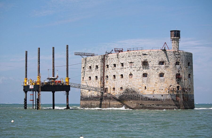 Fort Boyard standing in the water with the Charente-Maritime coast beyond