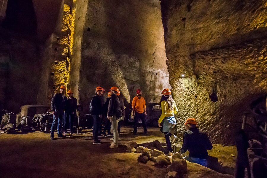 Galleria Borbonica visitors walking through tunnel refuge
