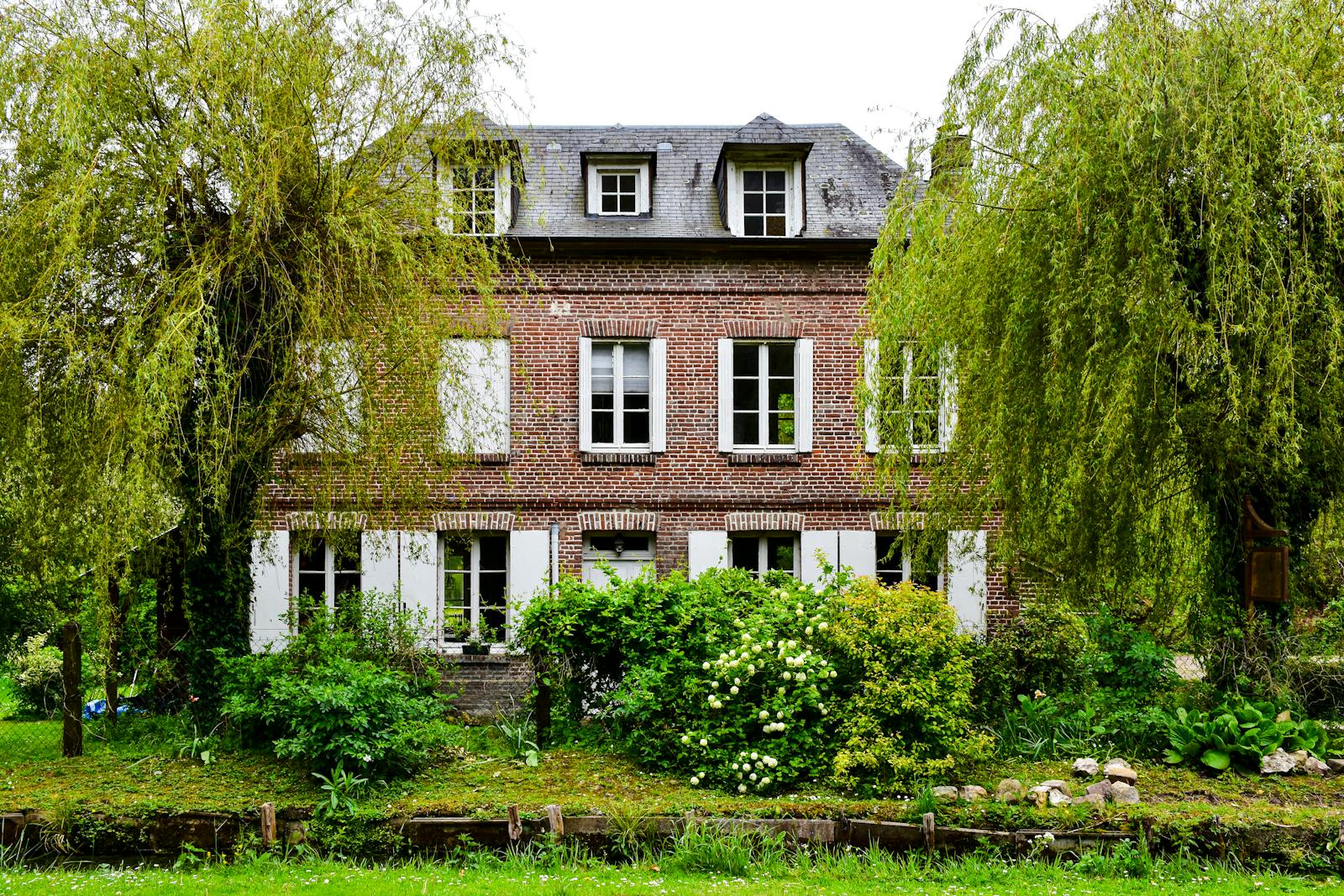 Normandy brick house with a lush garden near Giverny France