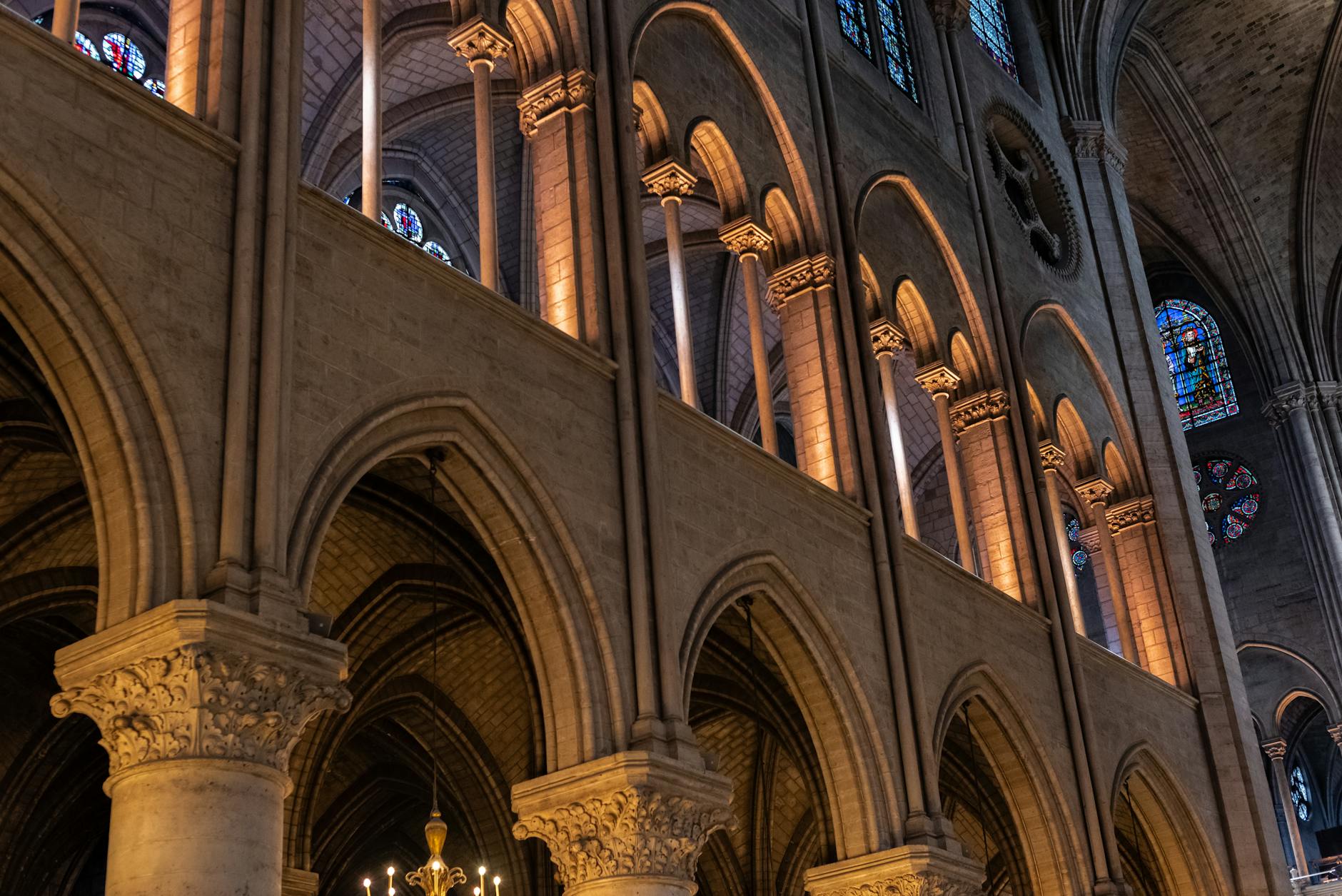 Gothic arches and stained glass in a French church interior