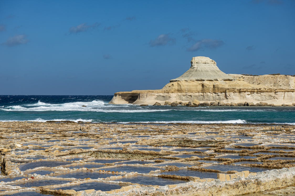 Salt pans and rocky coastline of Gozo Malta