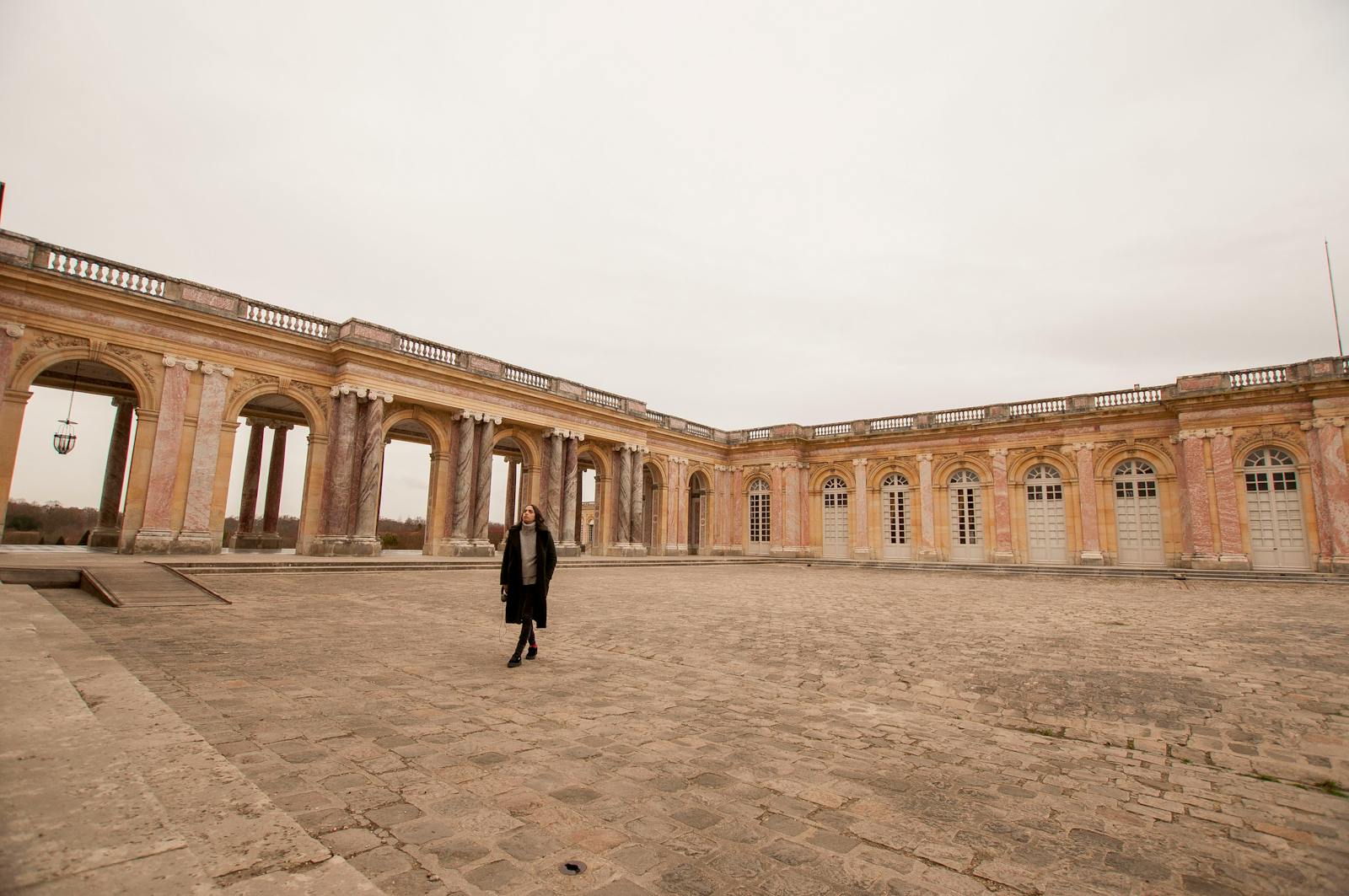 Grand Trianon Palace courtyard at Versailles with visitors