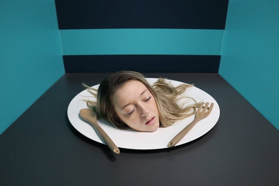 Surreal head on a plate exhibit in a museum of illusions