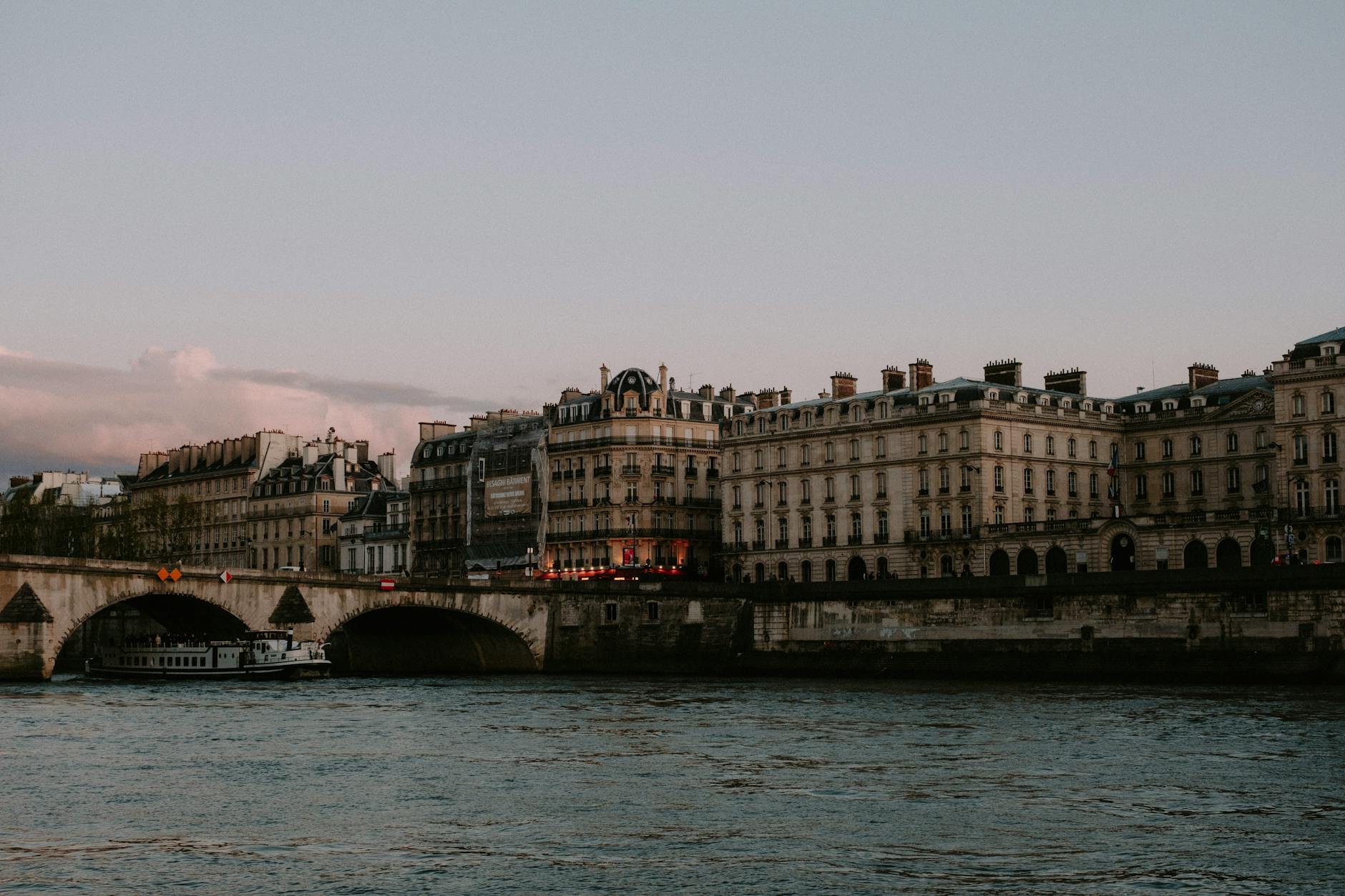 Historic buildings and a bridge over the Seine river in Paris