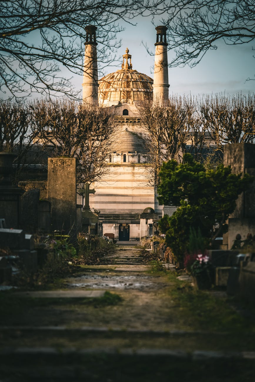 Historic Paris cemetery path with view toward Sacre-Coeur