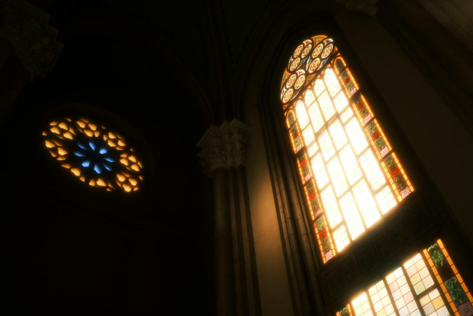 Historic church interior illuminated by stained-glass windows