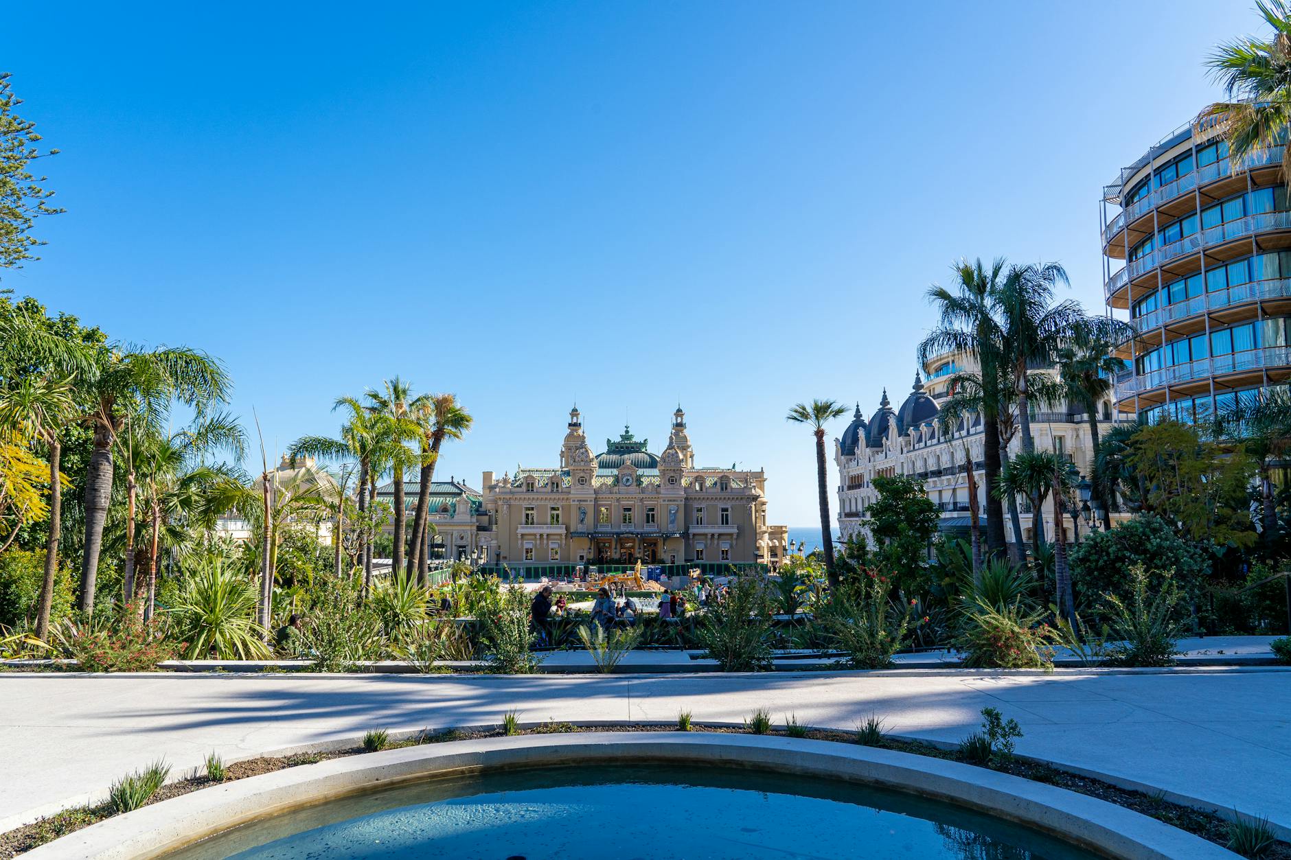 Hotel de Paris and Monte Carlo Casino with palm trees and clear blue sky