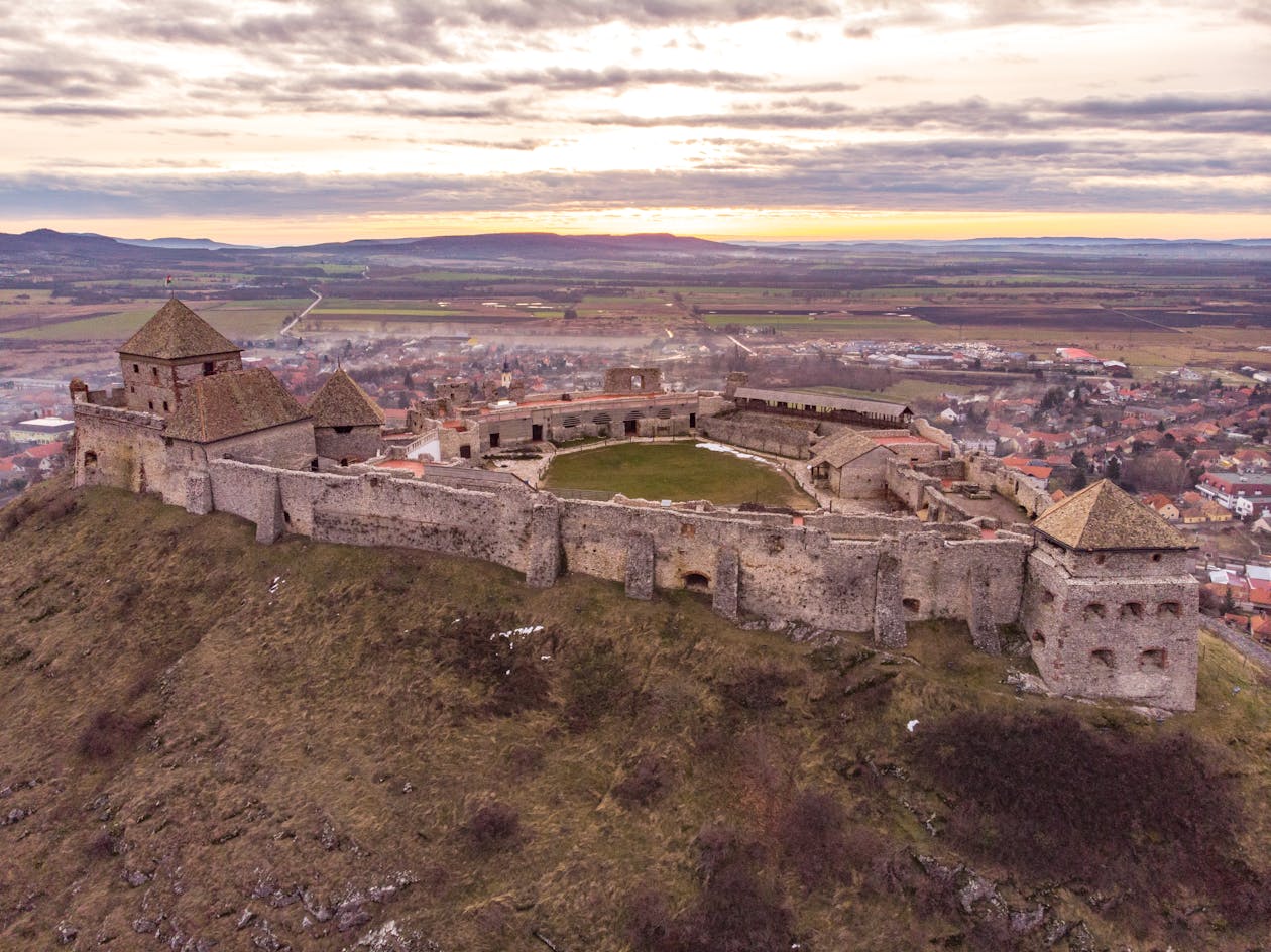 Stunning aerial view of a historic castle on a hilltop in Hungary
