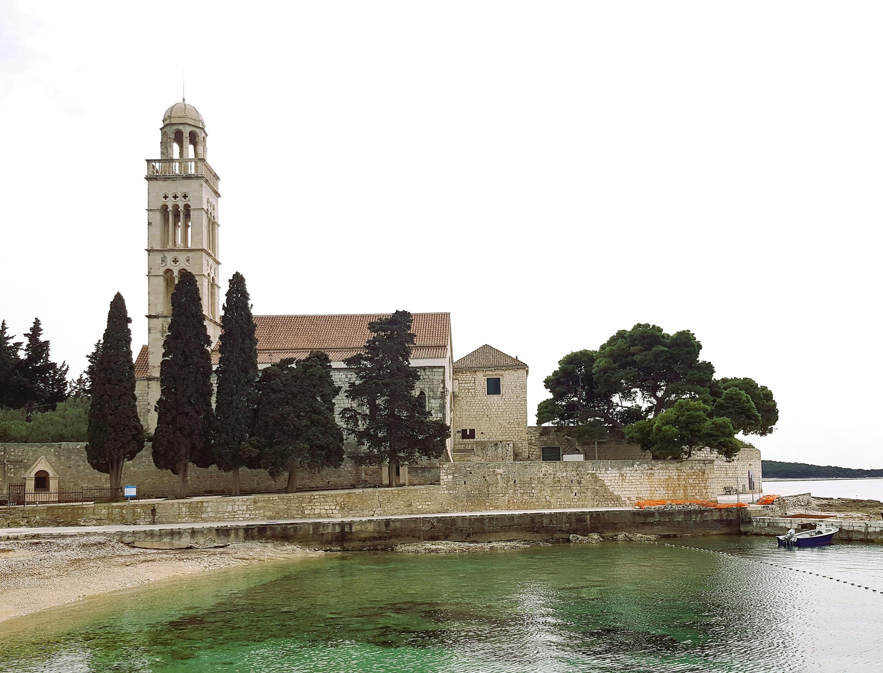 Scenic view of the historic Franciscan Monastery by the waterfront in Hvar, Croatia