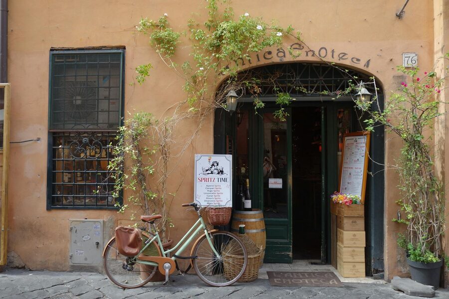 Italian enoteca entrance with vintage bicycle