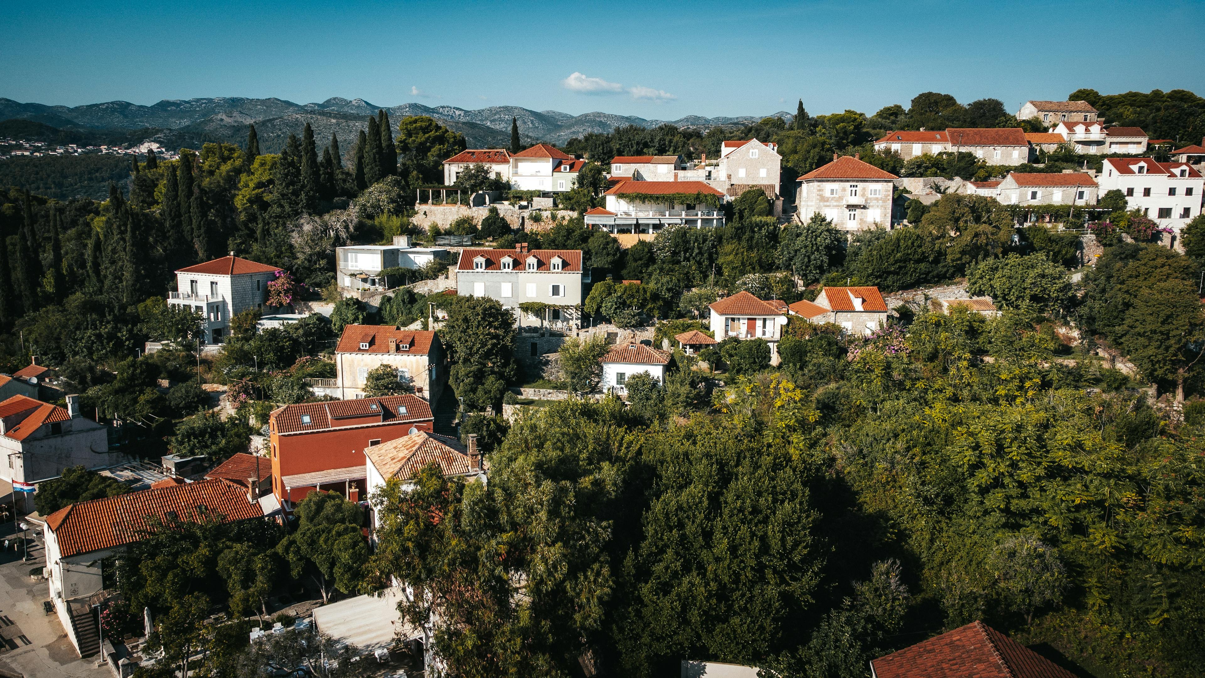 Explore the stunning hillside village of Kolocep, Croatia, featuring traditional Mediterranean architecture