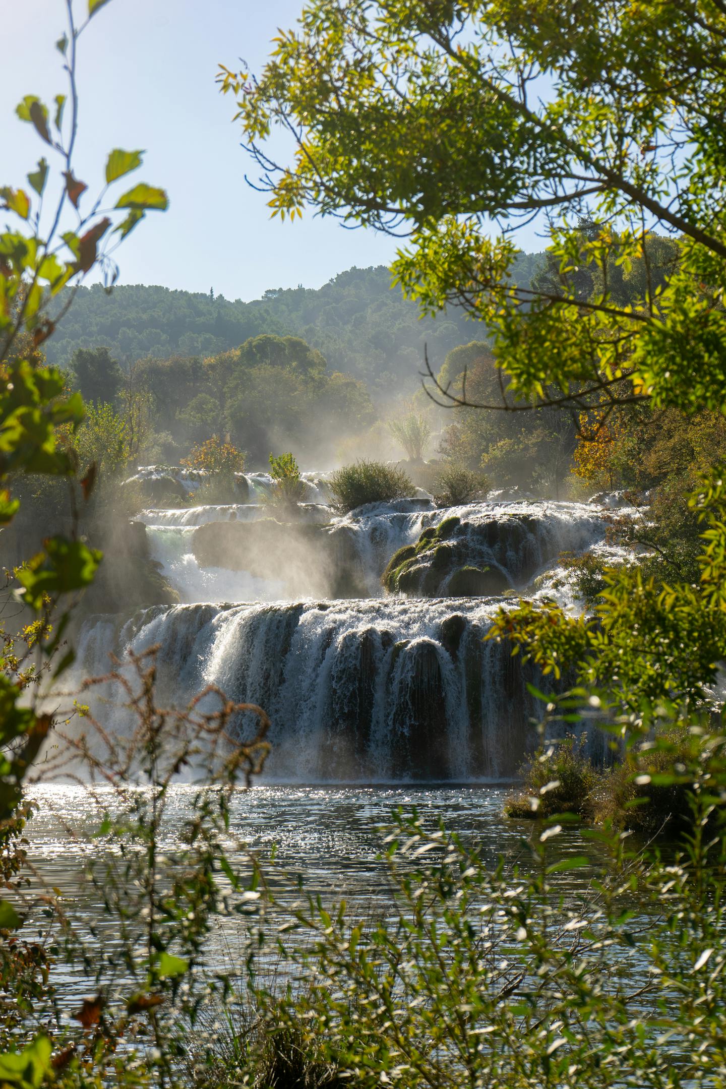 Beautiful cascading waterfalls surrounded by lush greenery in Krka National Park