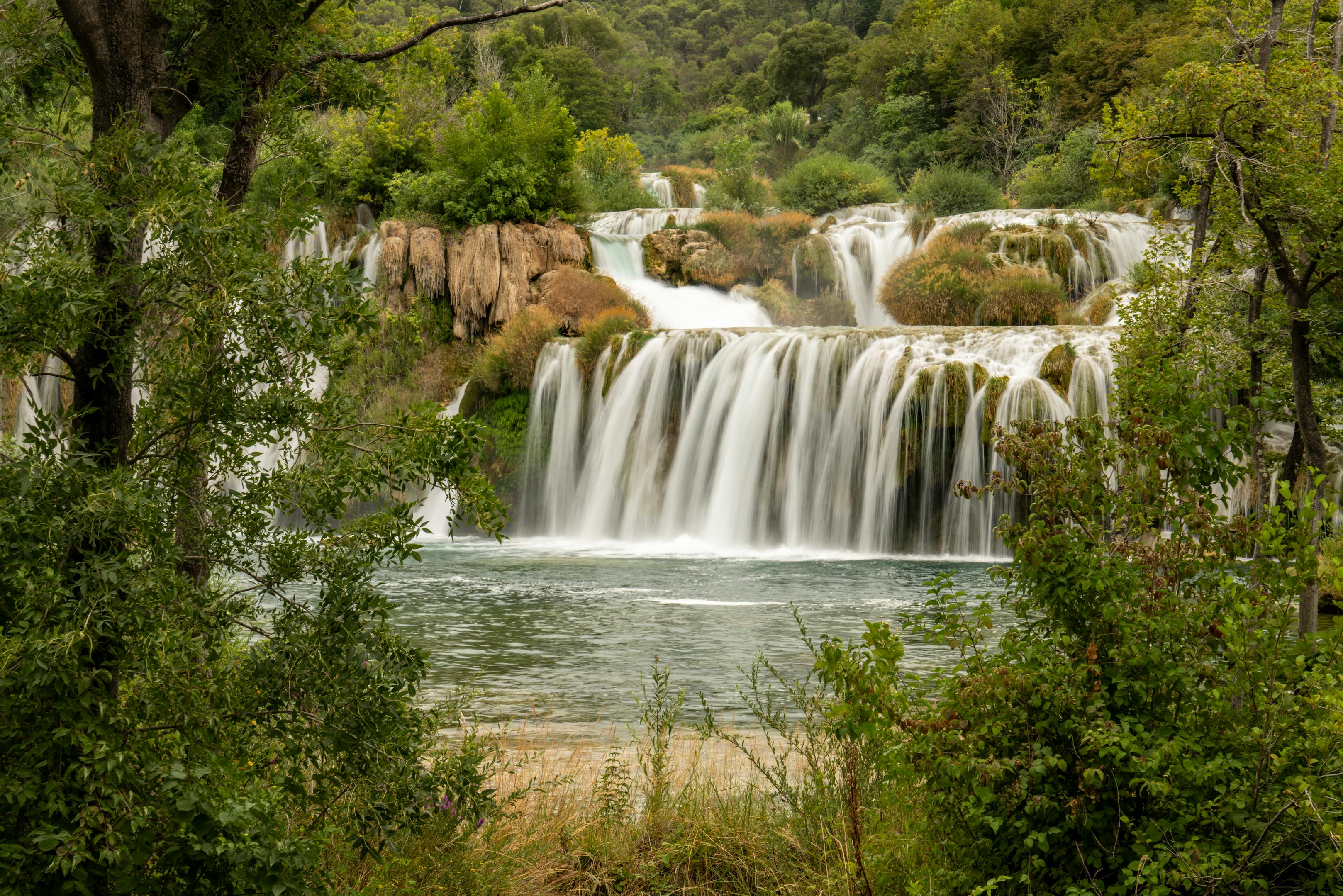 Stunning natural cascades in Krka National Park showcasing lush greenery and tranquil waters