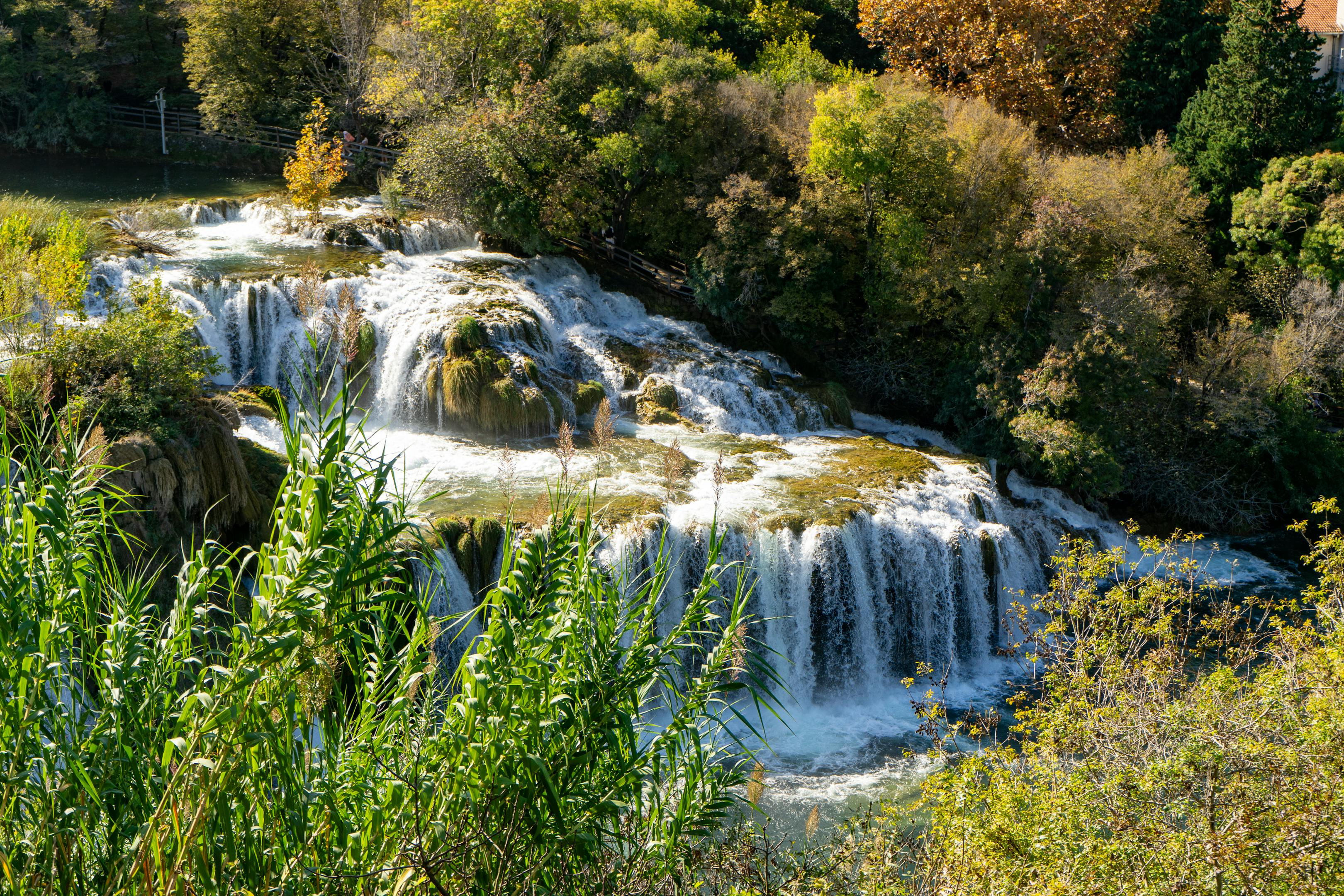 A picturesque view of waterfalls surrounded by lush greenery in Krka National Park