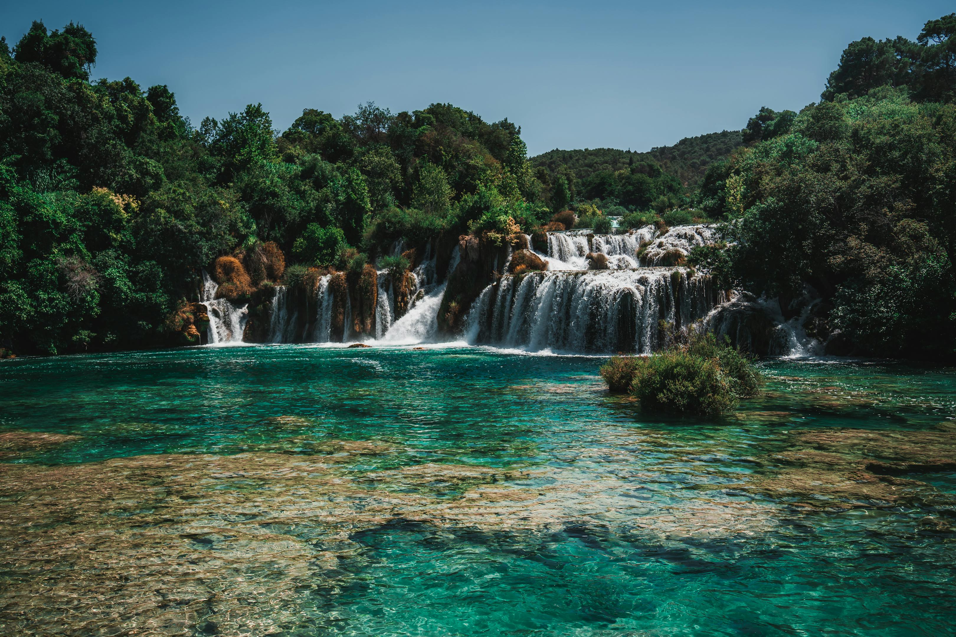 Vibrant waterfalls in Krka National Park showcasing lush scenery and turquoise waters