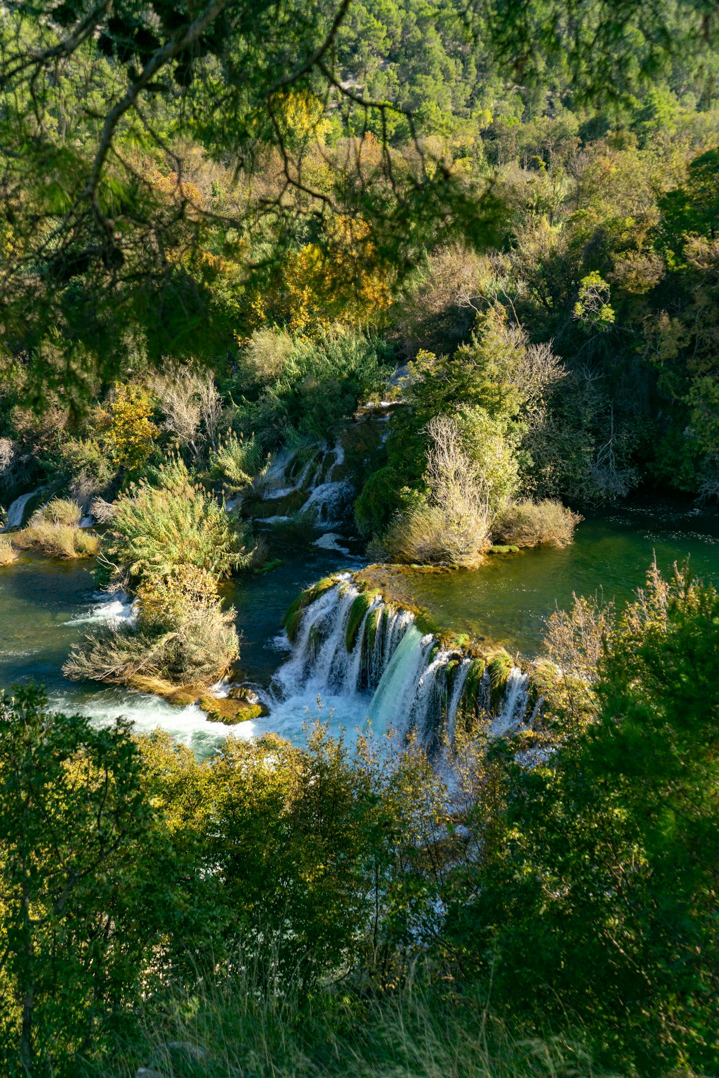 Explore the lush beauty of Krka National Park with its vibrant waterfalls and serene nature