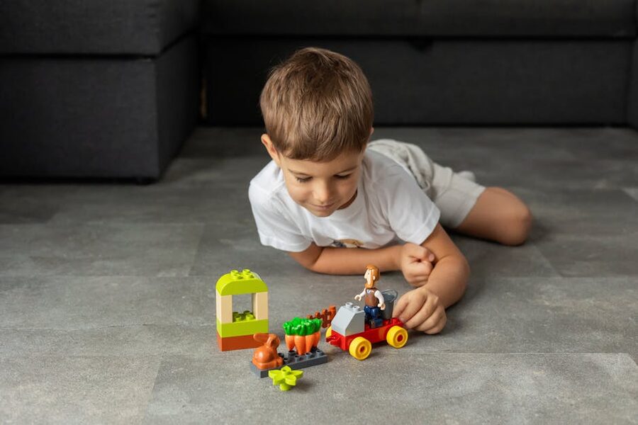 Young boy with colorful LEGO blocks