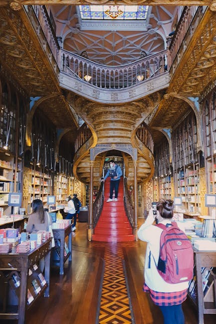 Famous red staircase inside Livraria Lello bookshop in Porto
