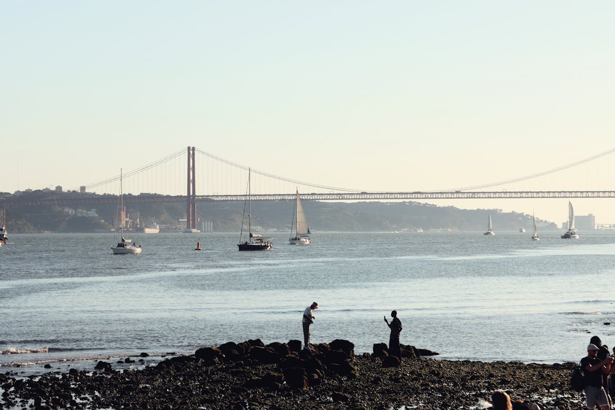 Sailboats near the 25 de Abril Bridge in Lisbon